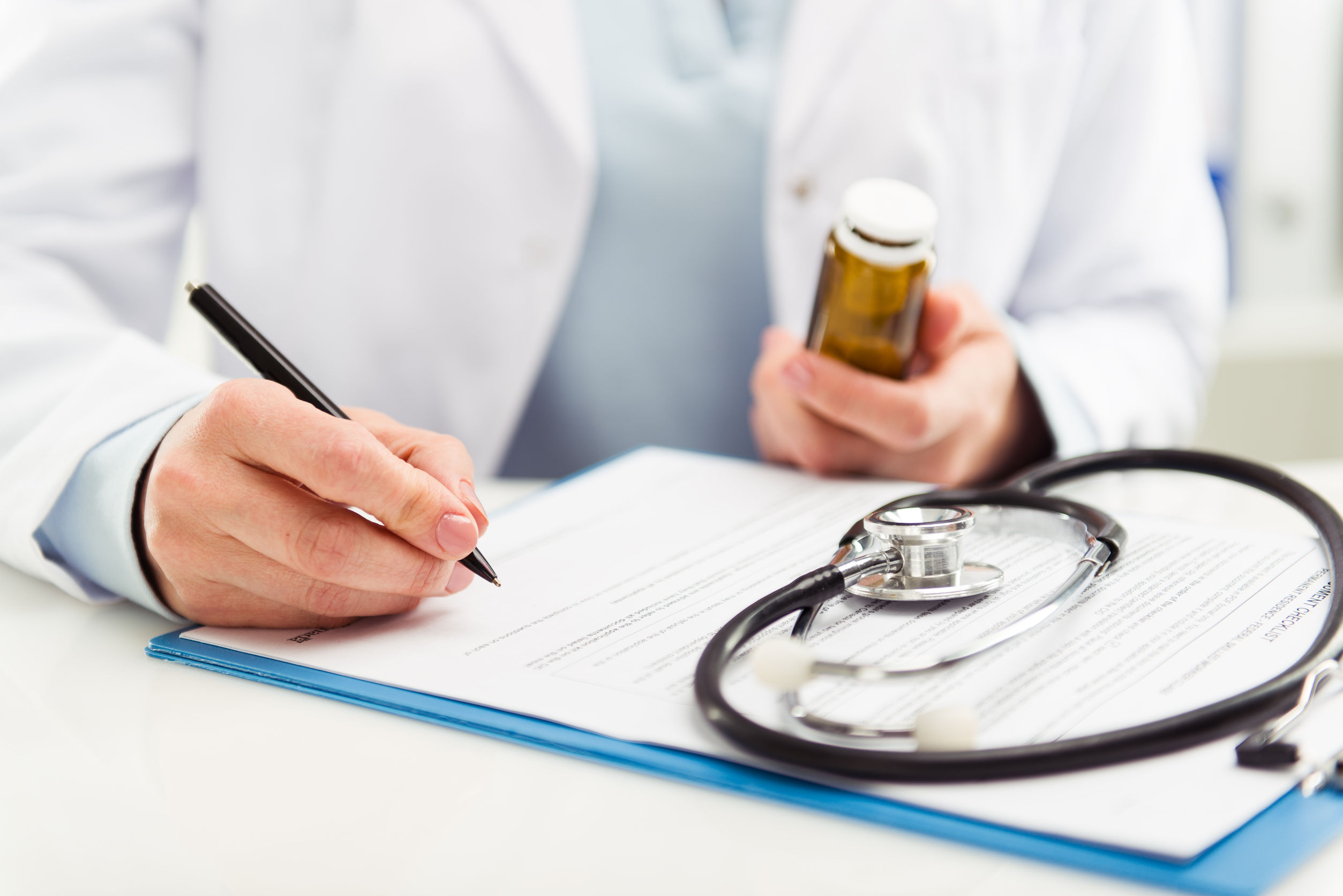 Doctor prescribing medications for patient