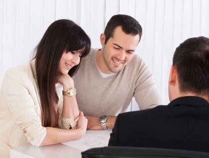 Young couple is discussing about international health insurance with an agent