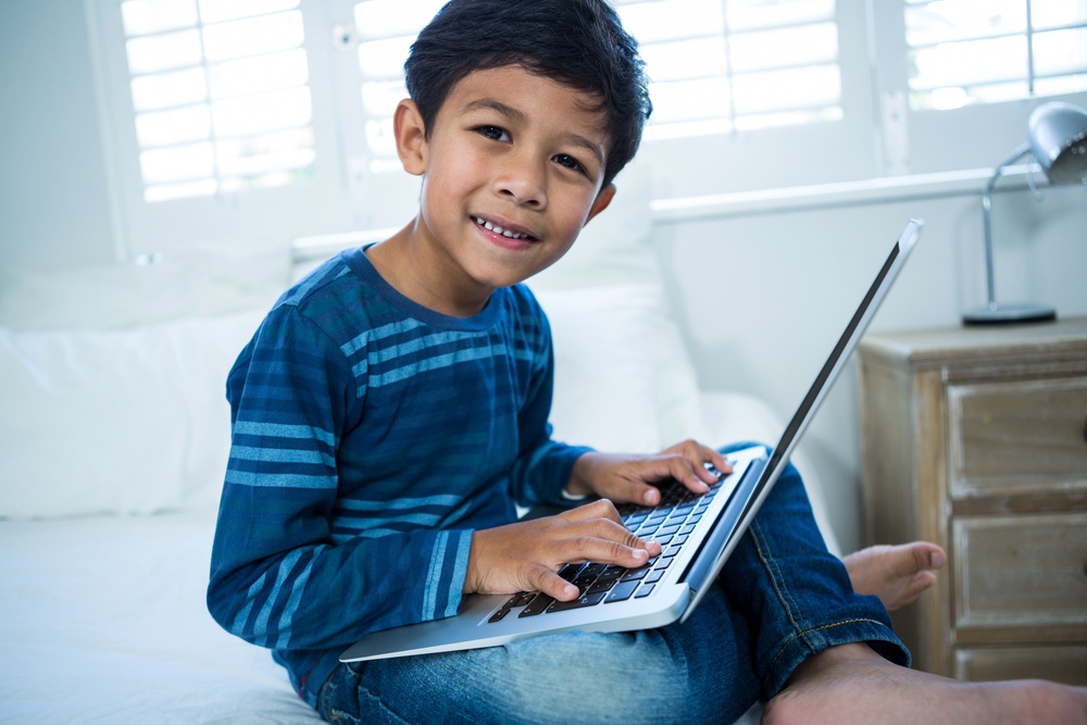 healthy boy using laptop 