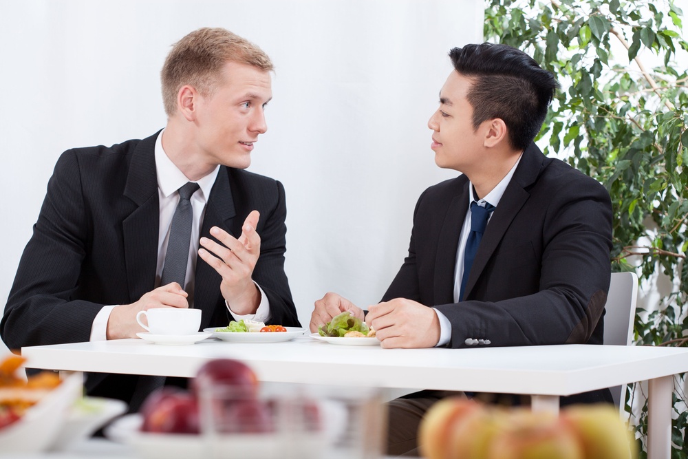 Diverse SME workers eating lunch in the office