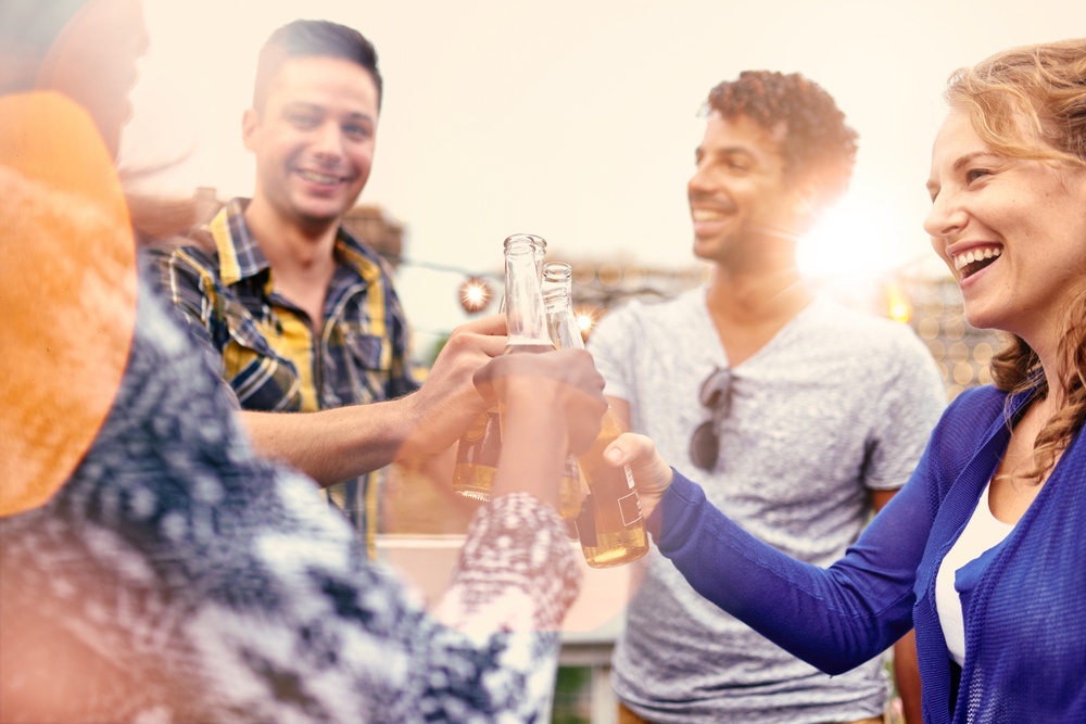 group of friends partying drinking alcohol health effects