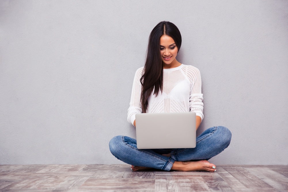 teenager on computer using social media